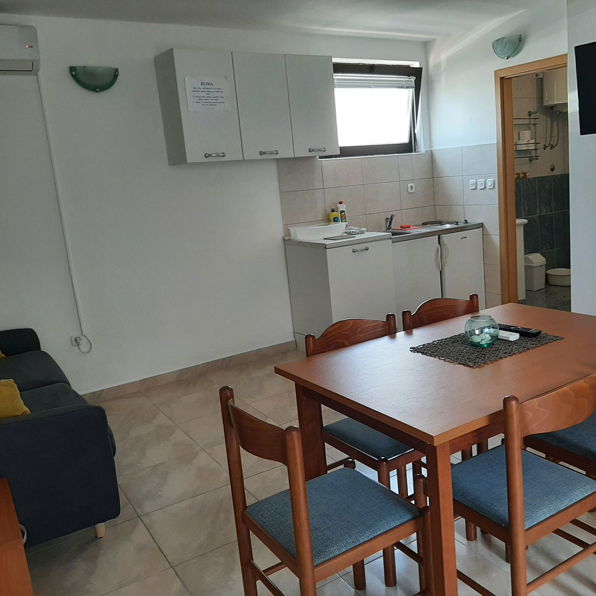 lining area dining area kitchen and bathroom in the vacation rental apartment